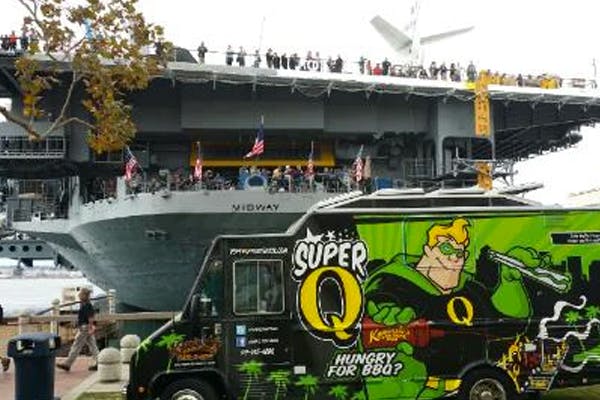 a boat sitting on top of a truck