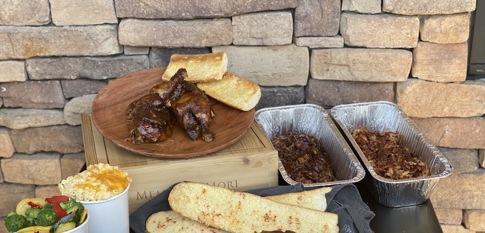 a plate of food sitting on top of a wooden table