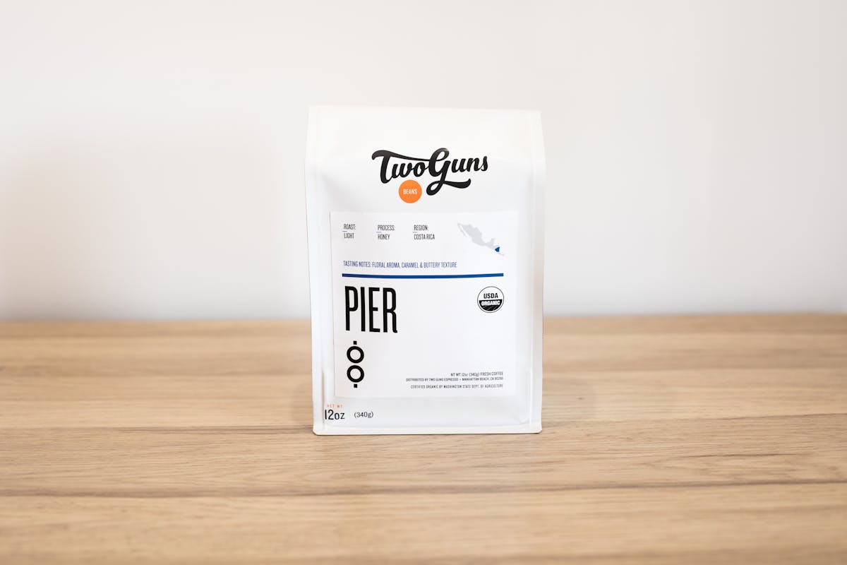 Photo of Pier (Single Origin)   Made with the environmentally friendly honey processing technique, this single origin bean requires zero water and very little electricity after harvesting. The result is a light, buttery roast with a slightly sweet flavor profile that’ll make your day.