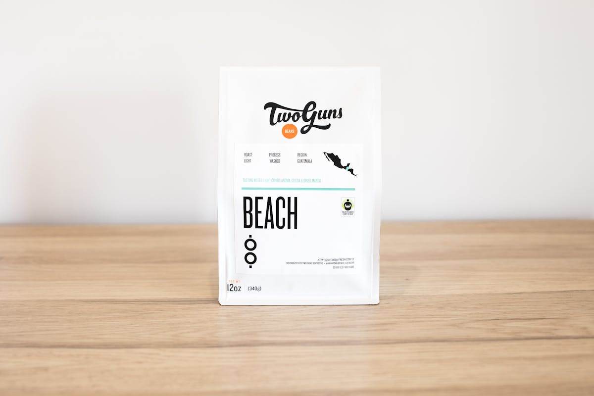 PHoto of Beach (Single Origin, Fair Trade Certified)  Light and balanced, this single-origin coffee hails from the Rio Azul Cooperative in Guatemala and is Fair Trade Certified. Let each sip transport you to warm sand, an ocean breeze and a smooth taste that’s pure heaven.