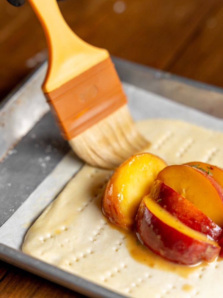 a slice of pizza sitting on top of a wooden table