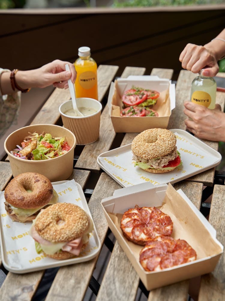 a person sitting at a table with a plate of food