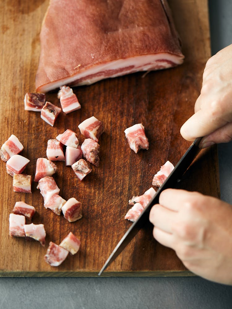 a person holding a knife and fork