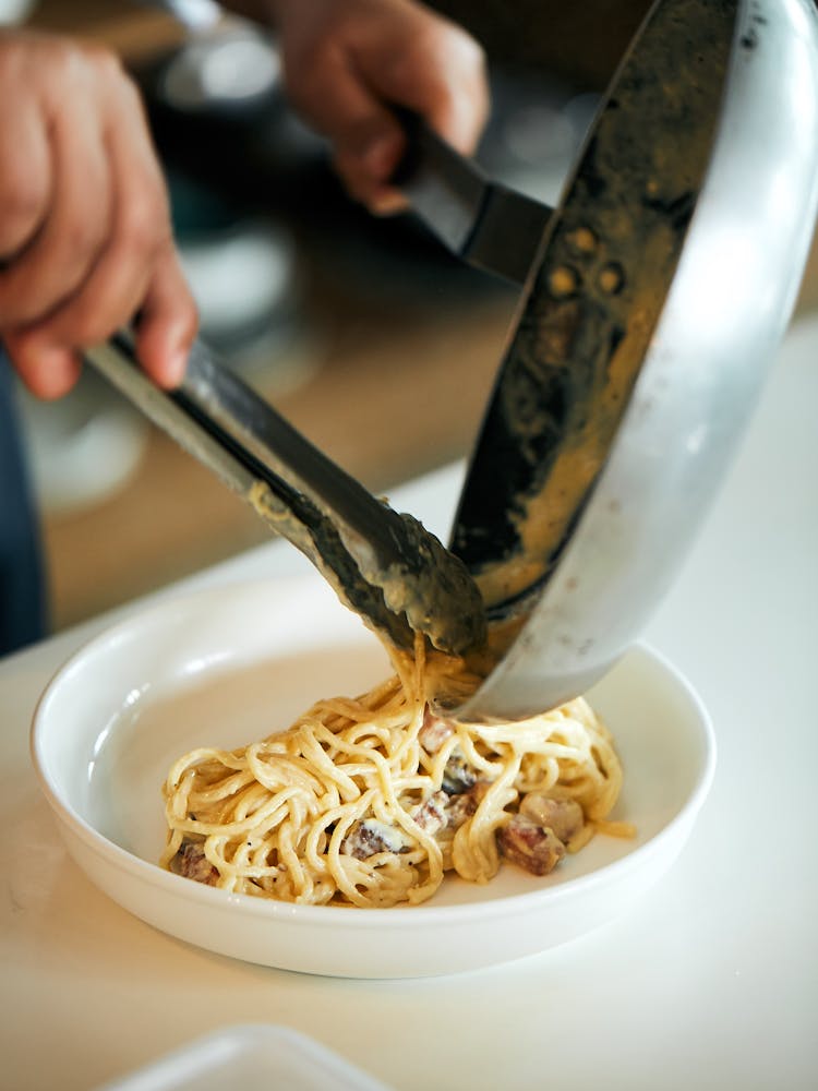 a bowl of food with a knife