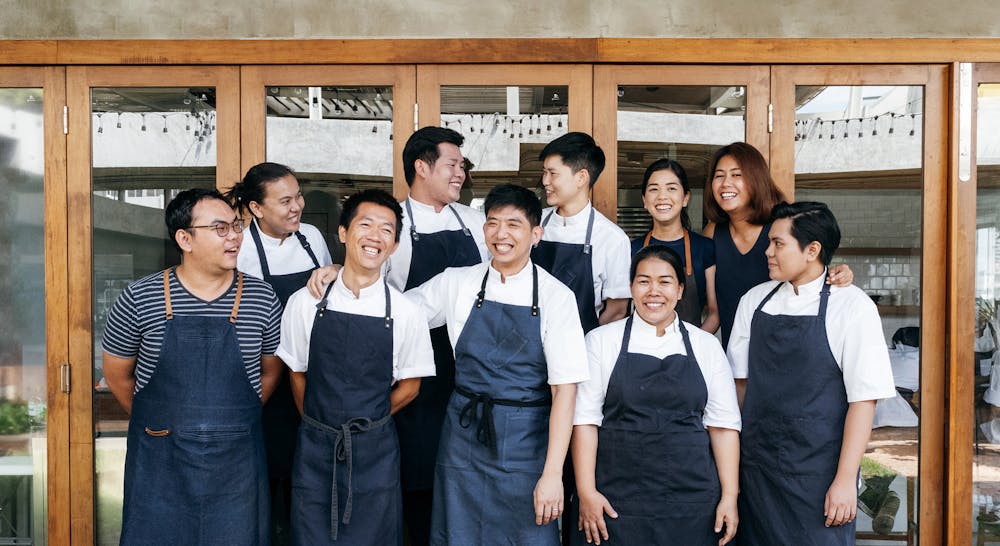 a group of people posing for the camera