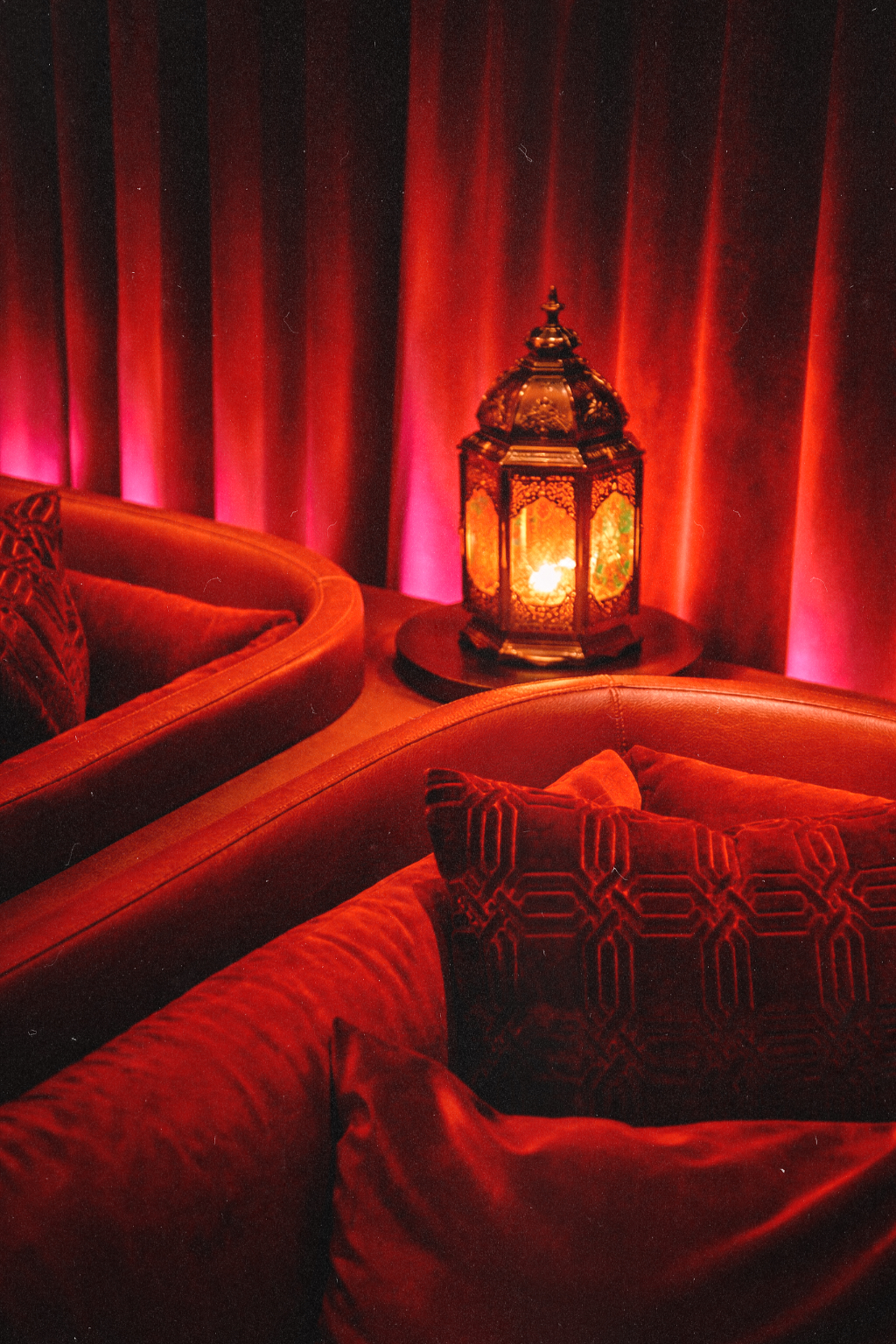 Intimate red velvet lounge seating inside Wax Rabbit speakeasy Las Vegas with warm lantern lighting, a stylish vinyl bar and one of the city’s coolest bars for live DJs.