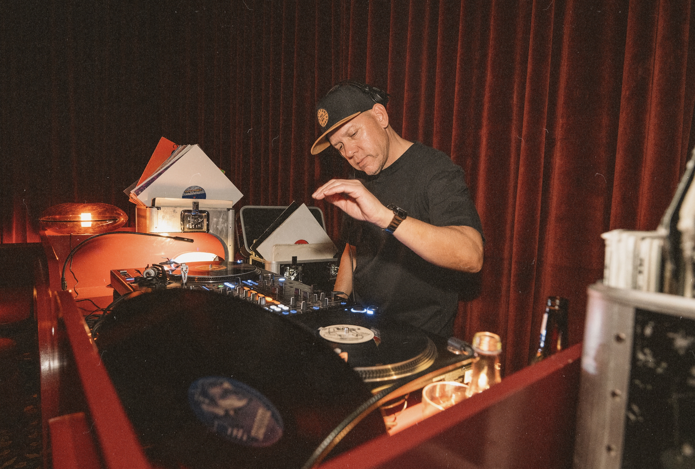 DJ spinning vinyl records at Wax Rabbit, a Las Vegas speakeasy and vinyl bar offering curated music, craft cocktails, and late-night lounge experiences.