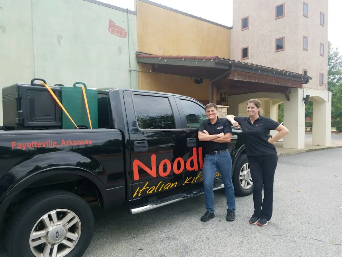 a man standing in front of a truck