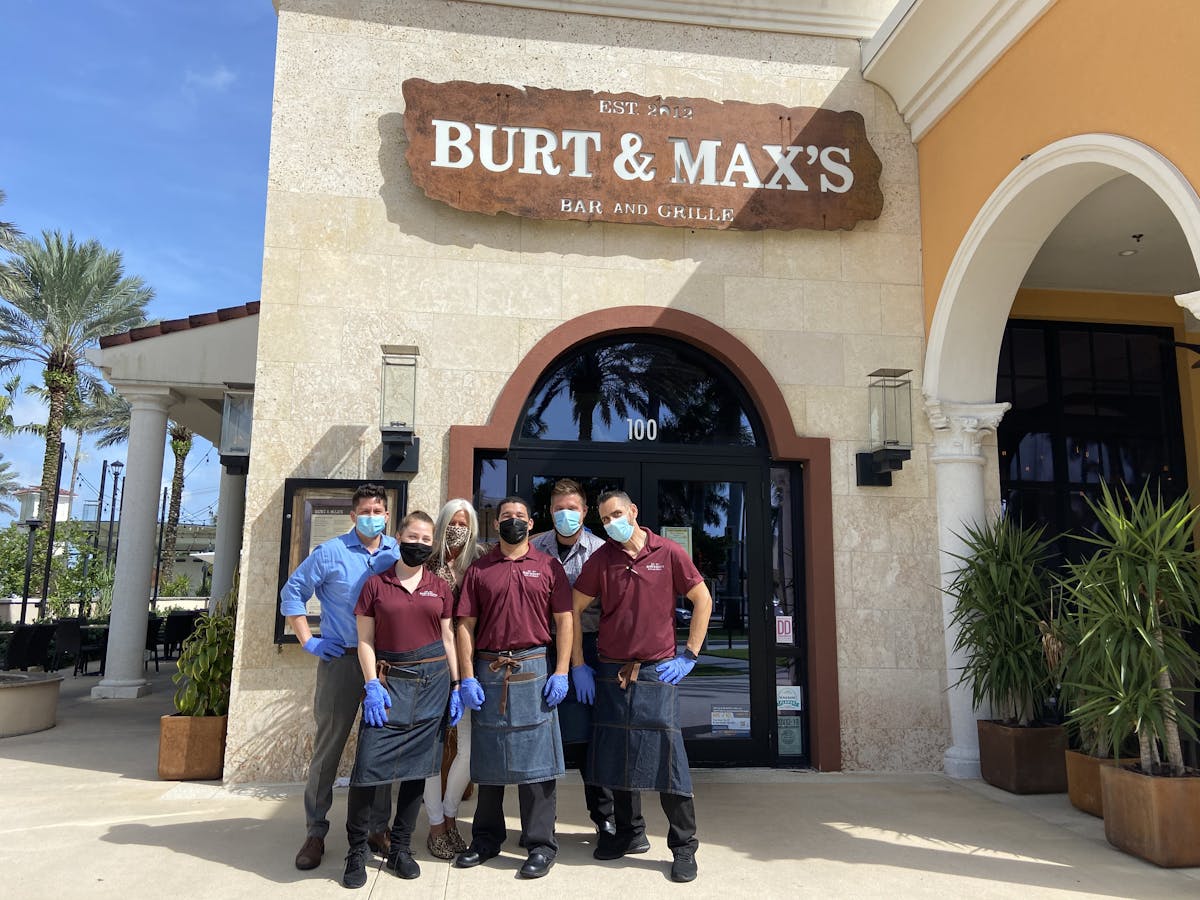 a group of people standing in front of a building