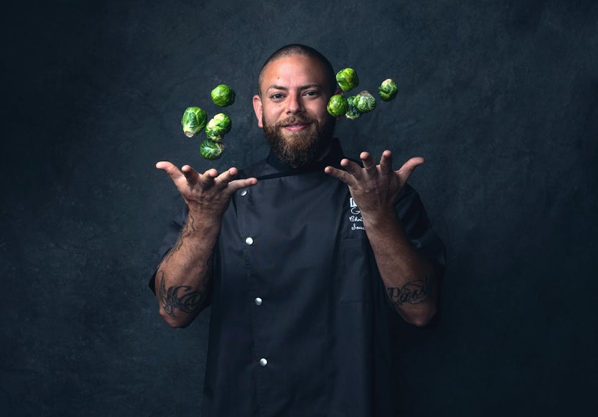 a man holding a green ball