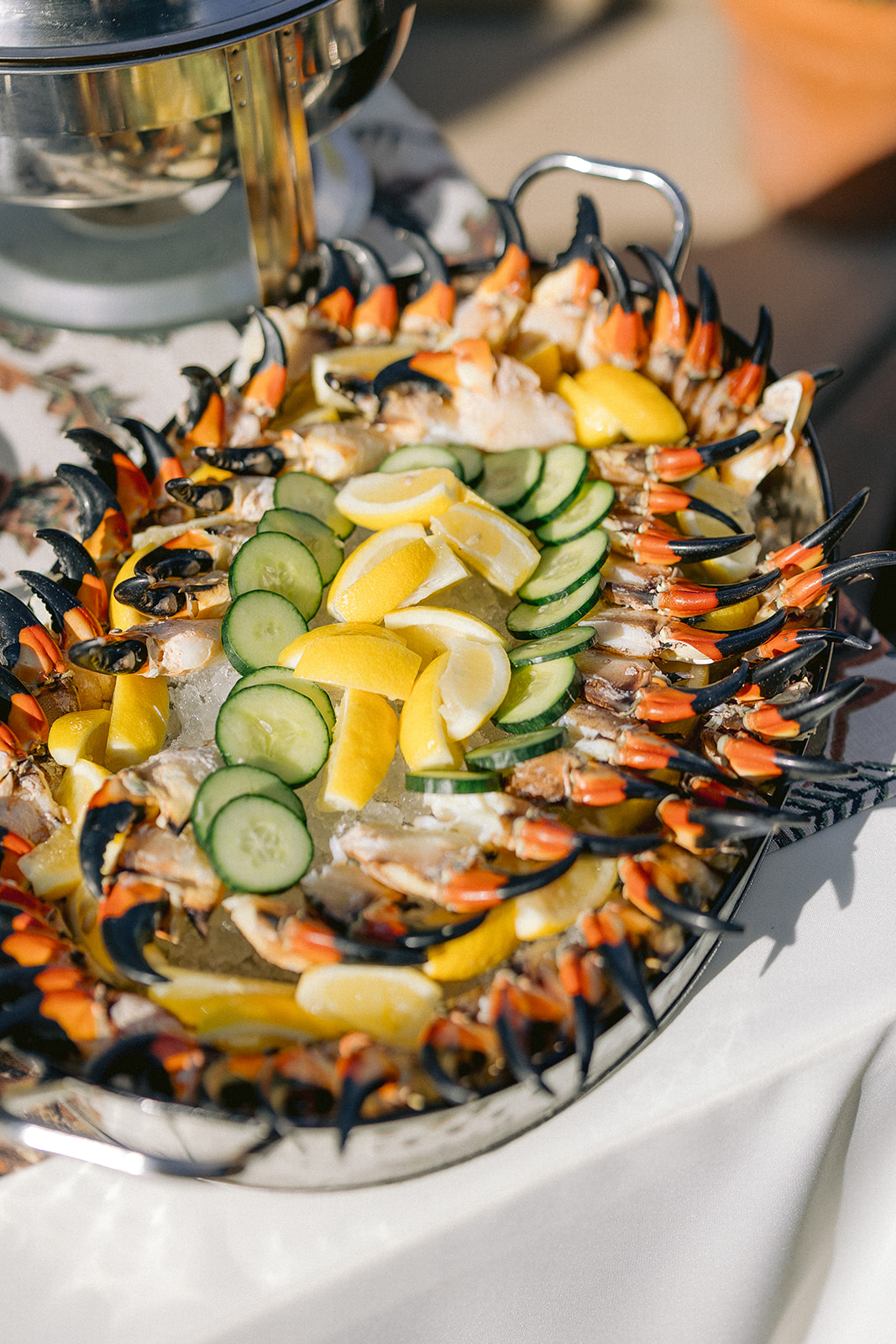 a large bowl of crab claws and lemon slices