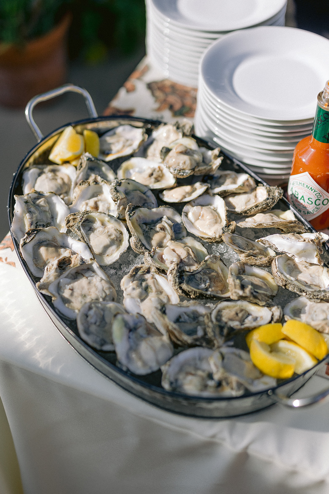 a tray of oysters and lemons