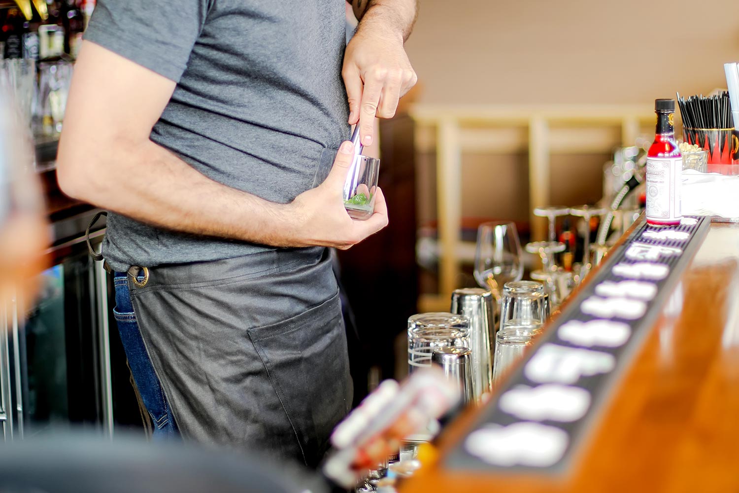 a bartender making a drink