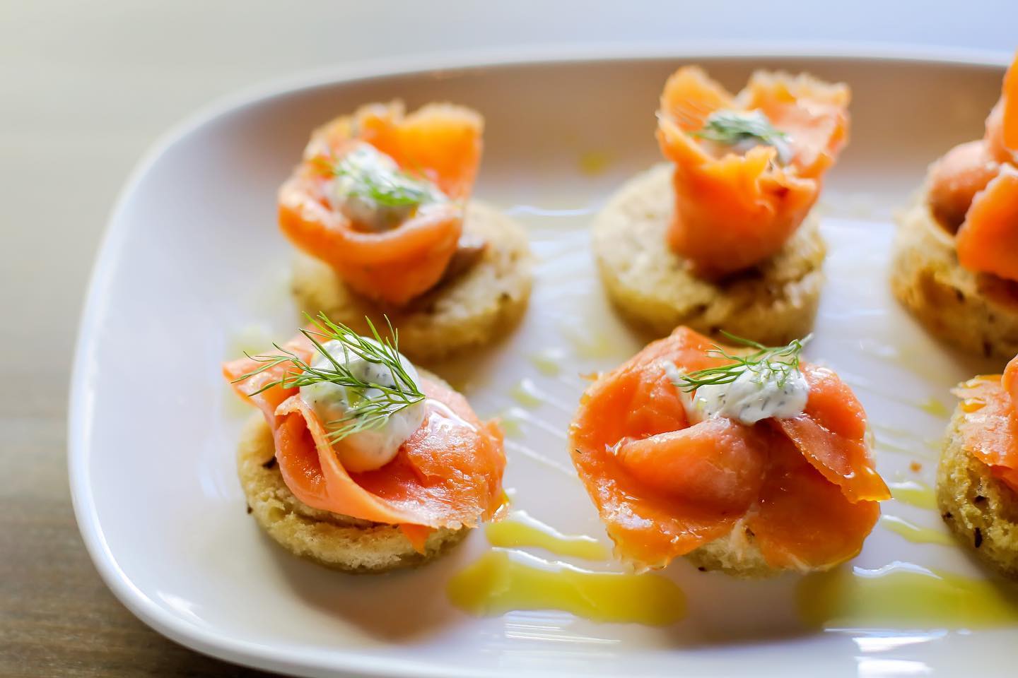 four small appetizers with cream cheese on top