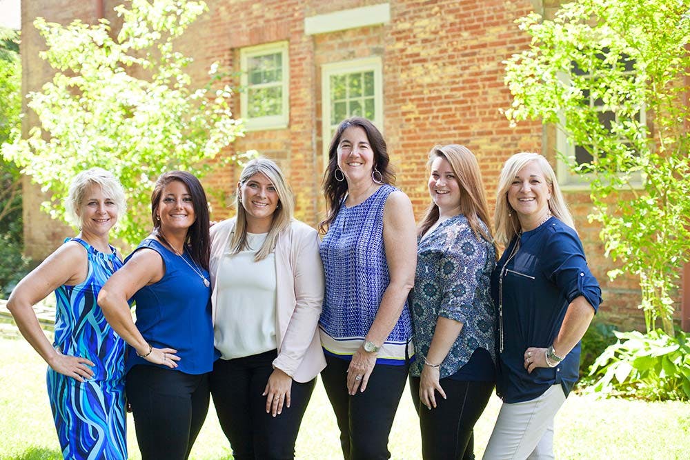 a group of women smiling