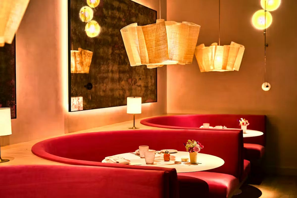 a hotel room with a sink and a mirror