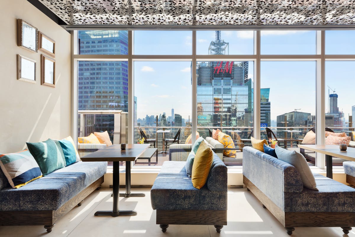 a living room filled with furniture and a large window