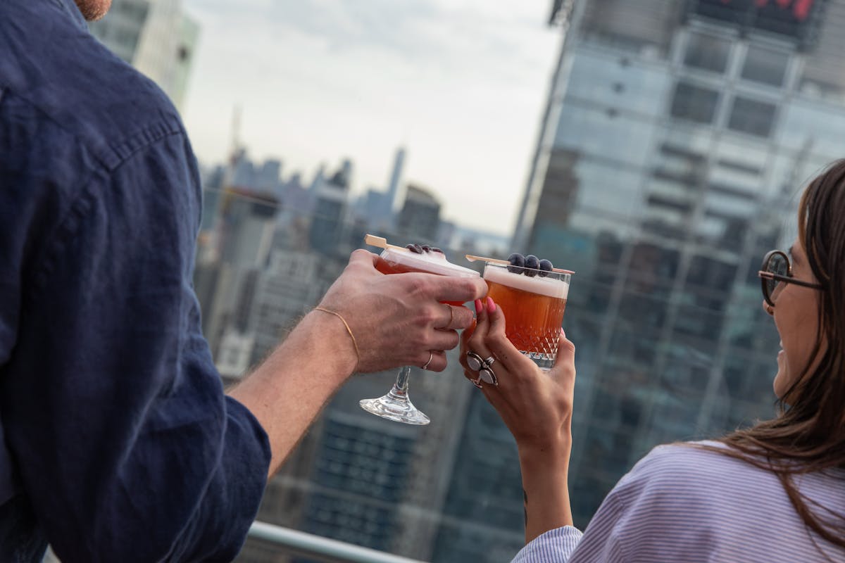 a group of people looking at a cell phone