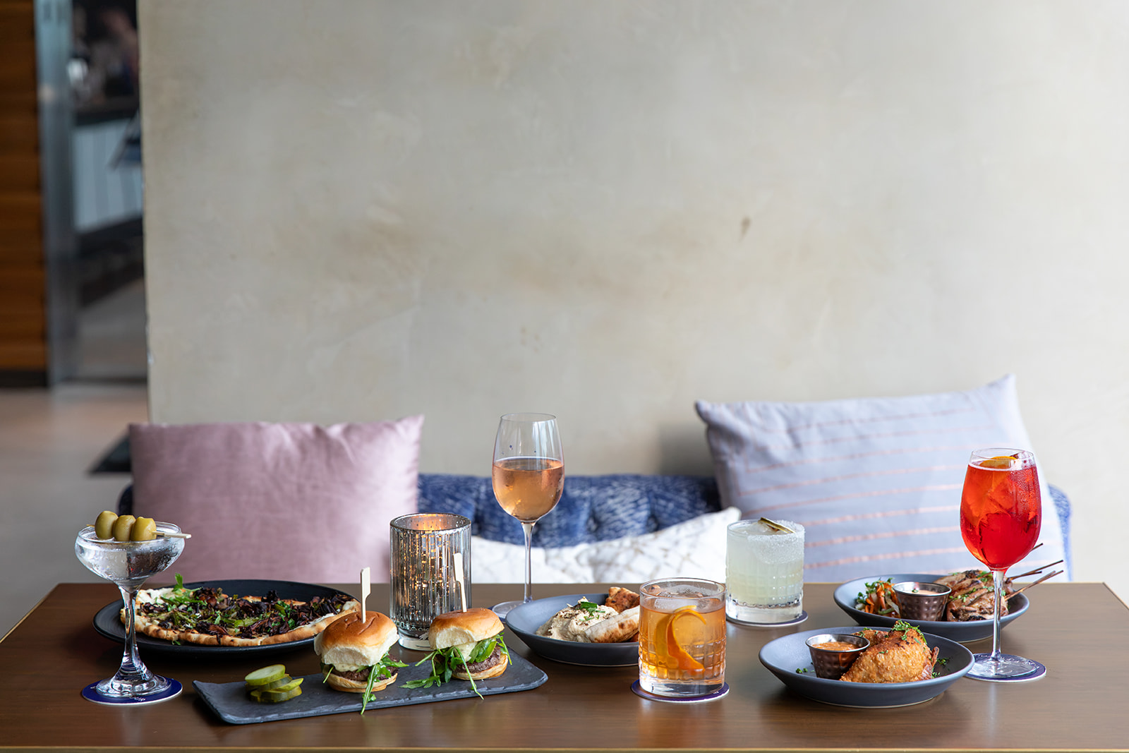 a table with plates of food and drinks