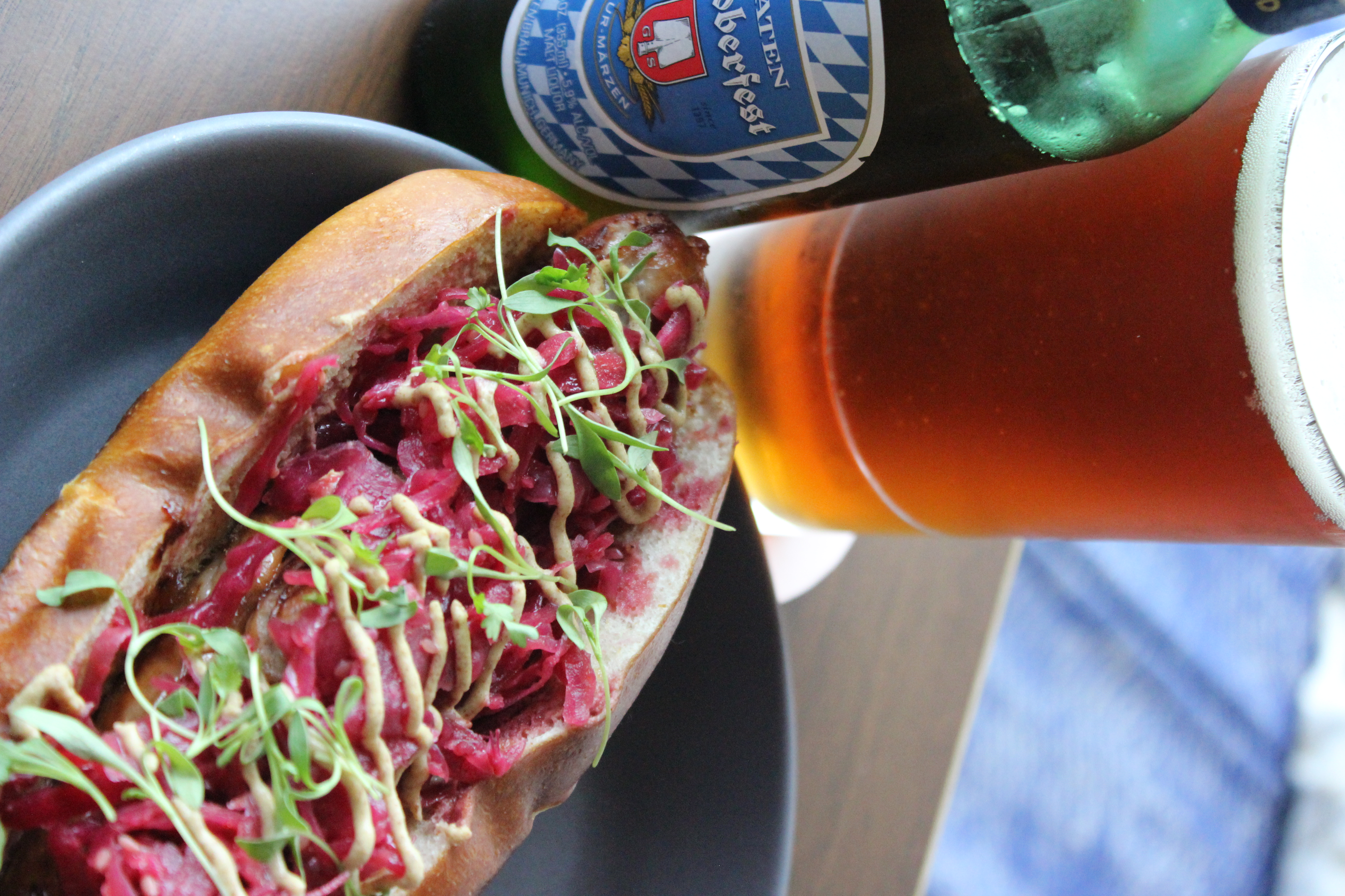 a plate of food with a glass of beer on a table