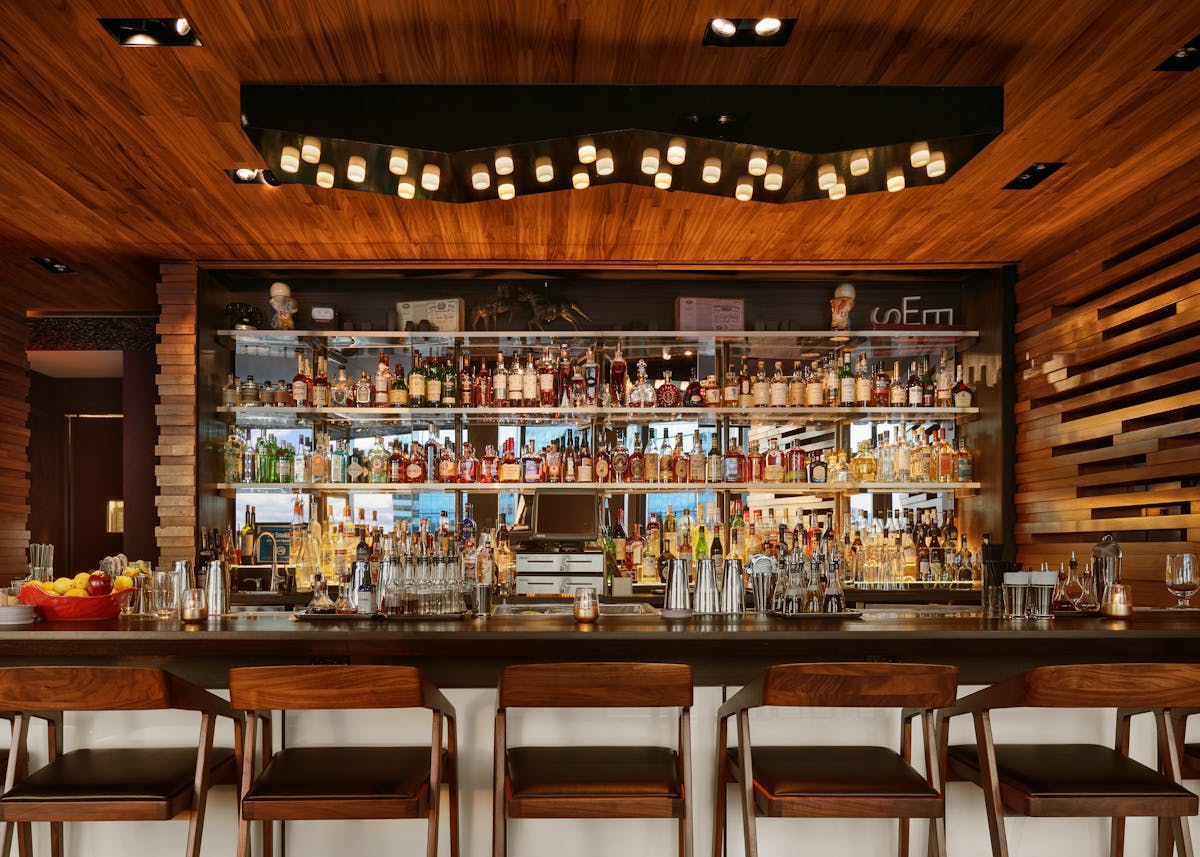 a group of people sitting at a table in a restaurant