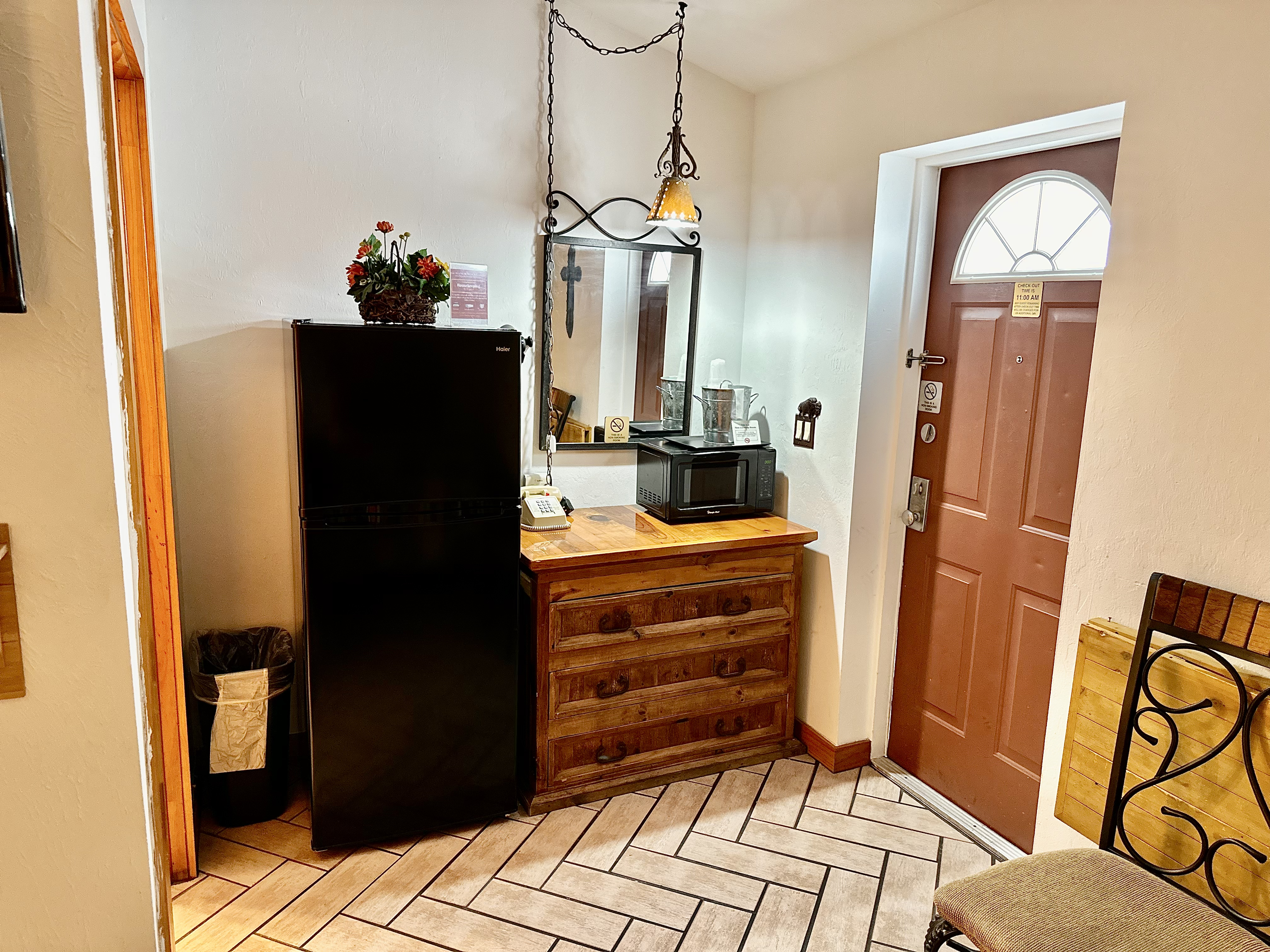 a bedroom with a bed and a mirror