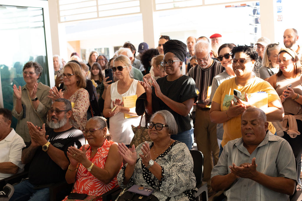 a group of people standing in front of a crowd