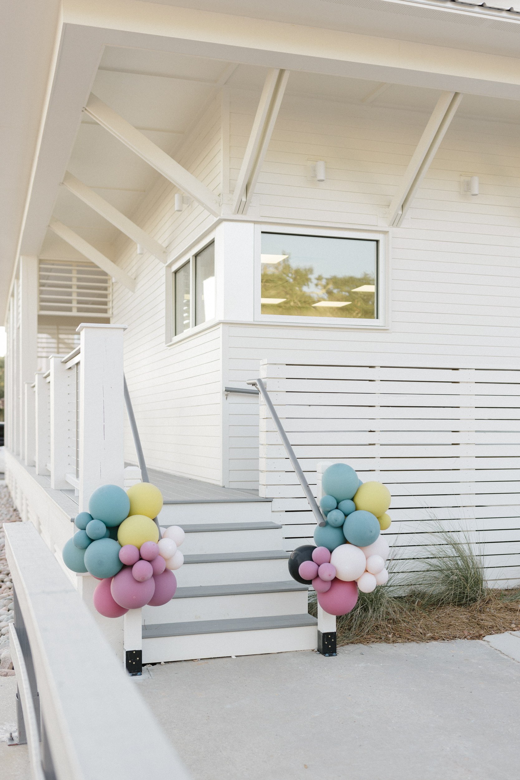 a group of stuffed animals sitting next to a window