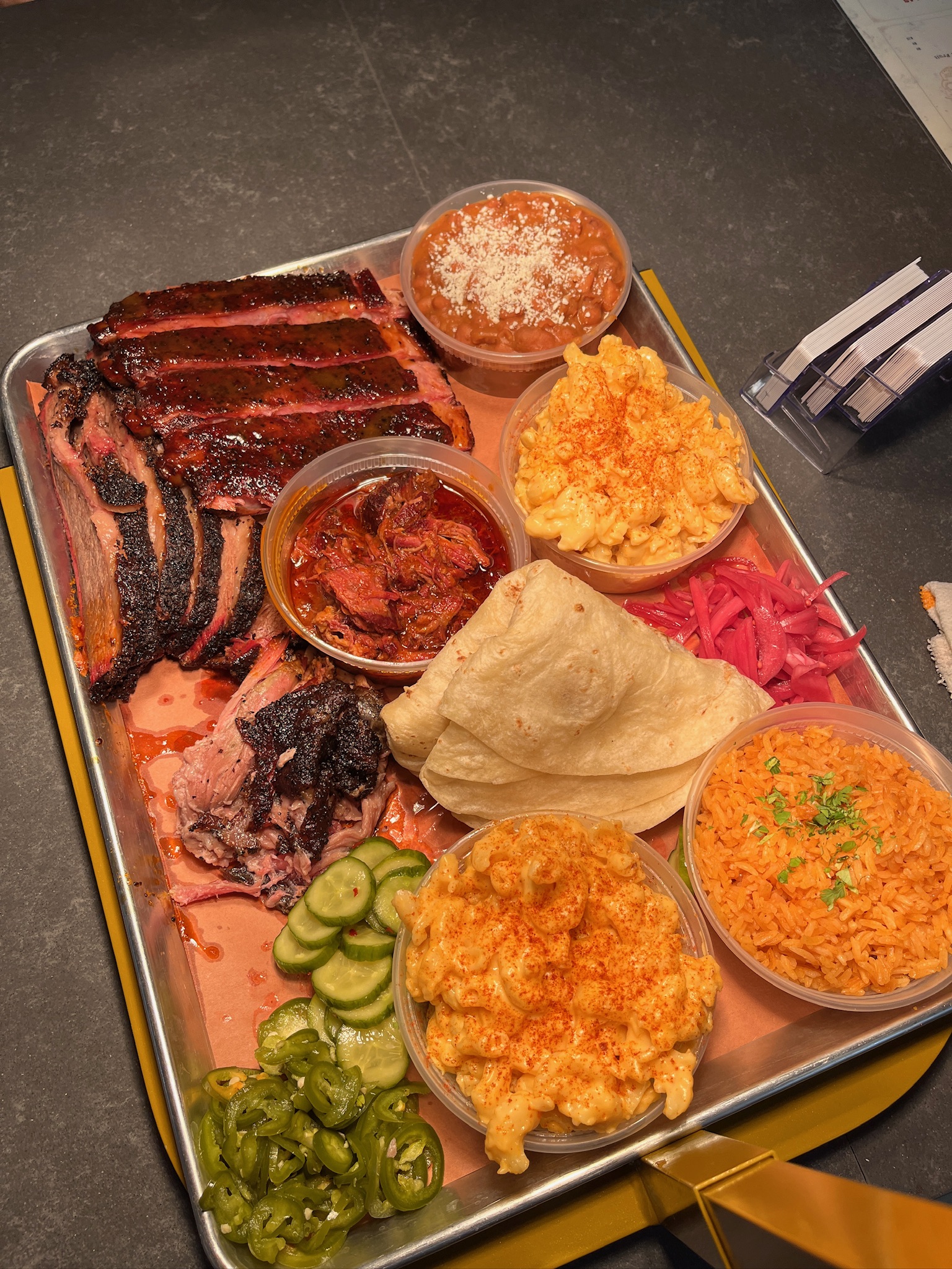 bbq platter spread of meats and sides
