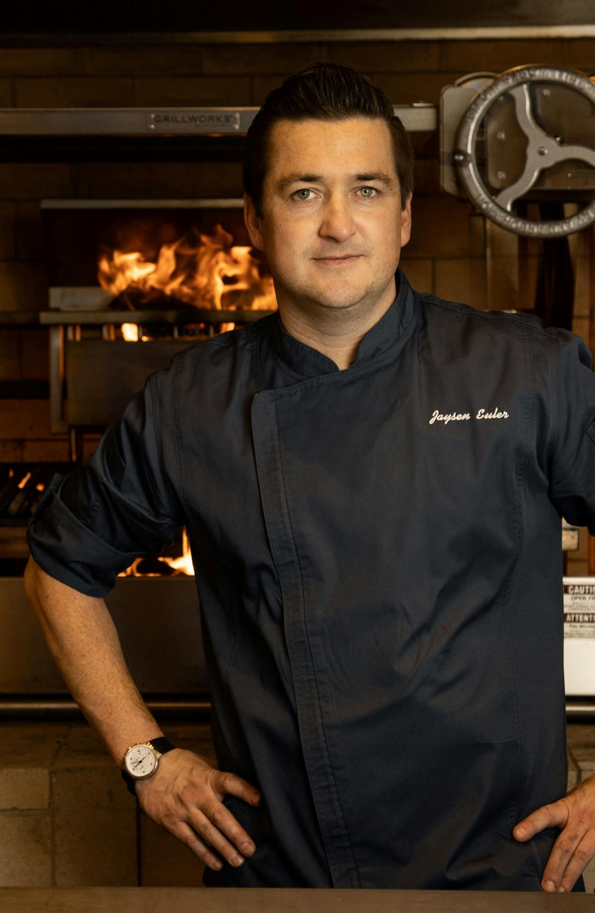 a man standing in front of a table