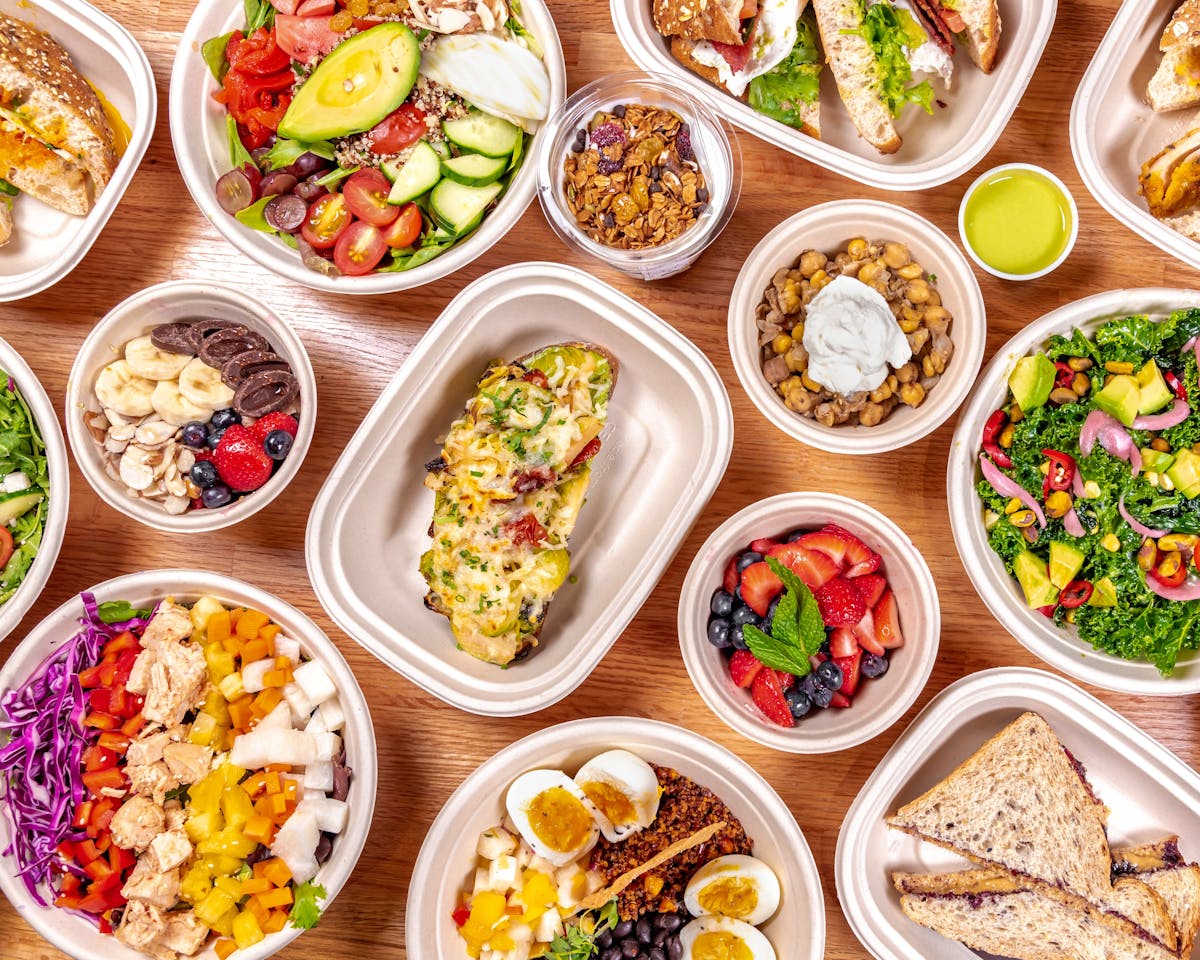 a bunch of food sitting on top of a wooden table