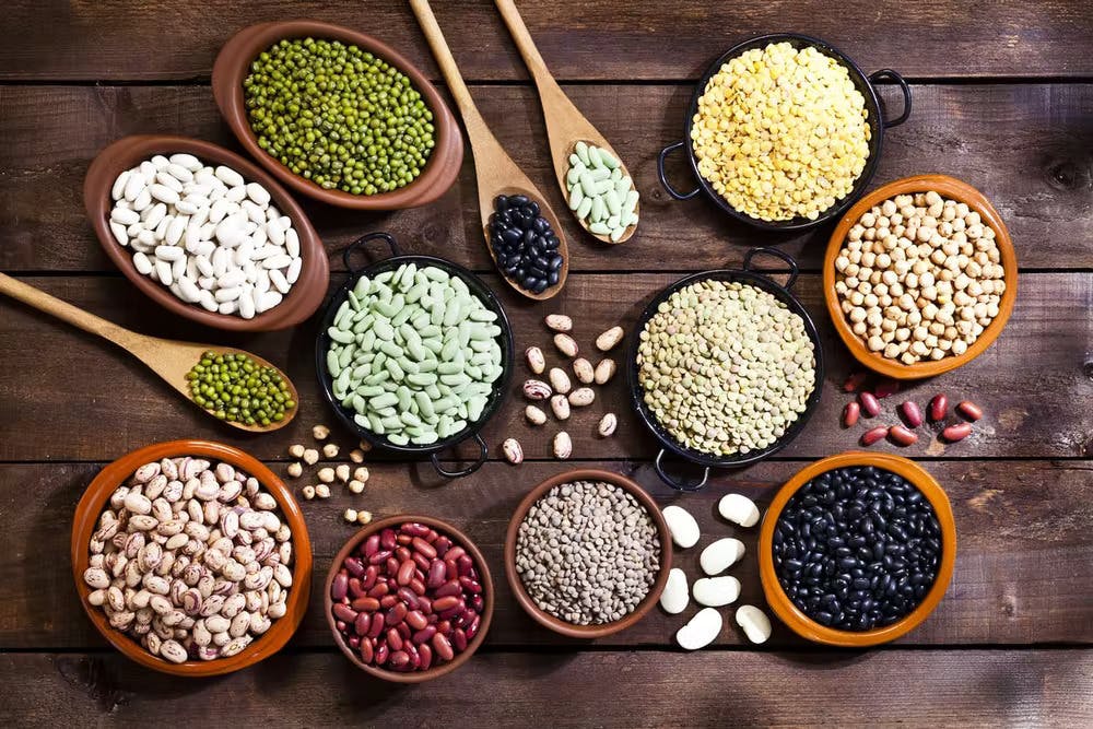 many different types of food on a wooden table