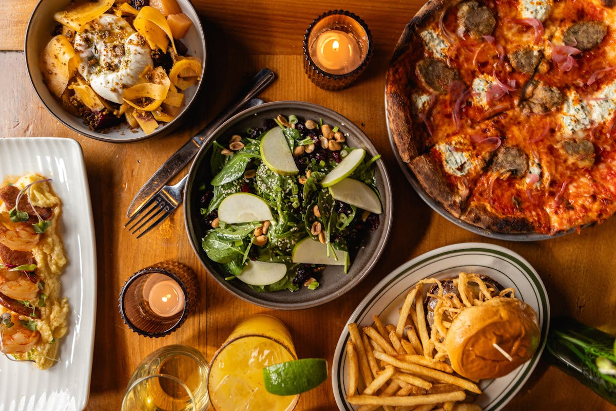 a bowl of food sitting on top of a wooden table