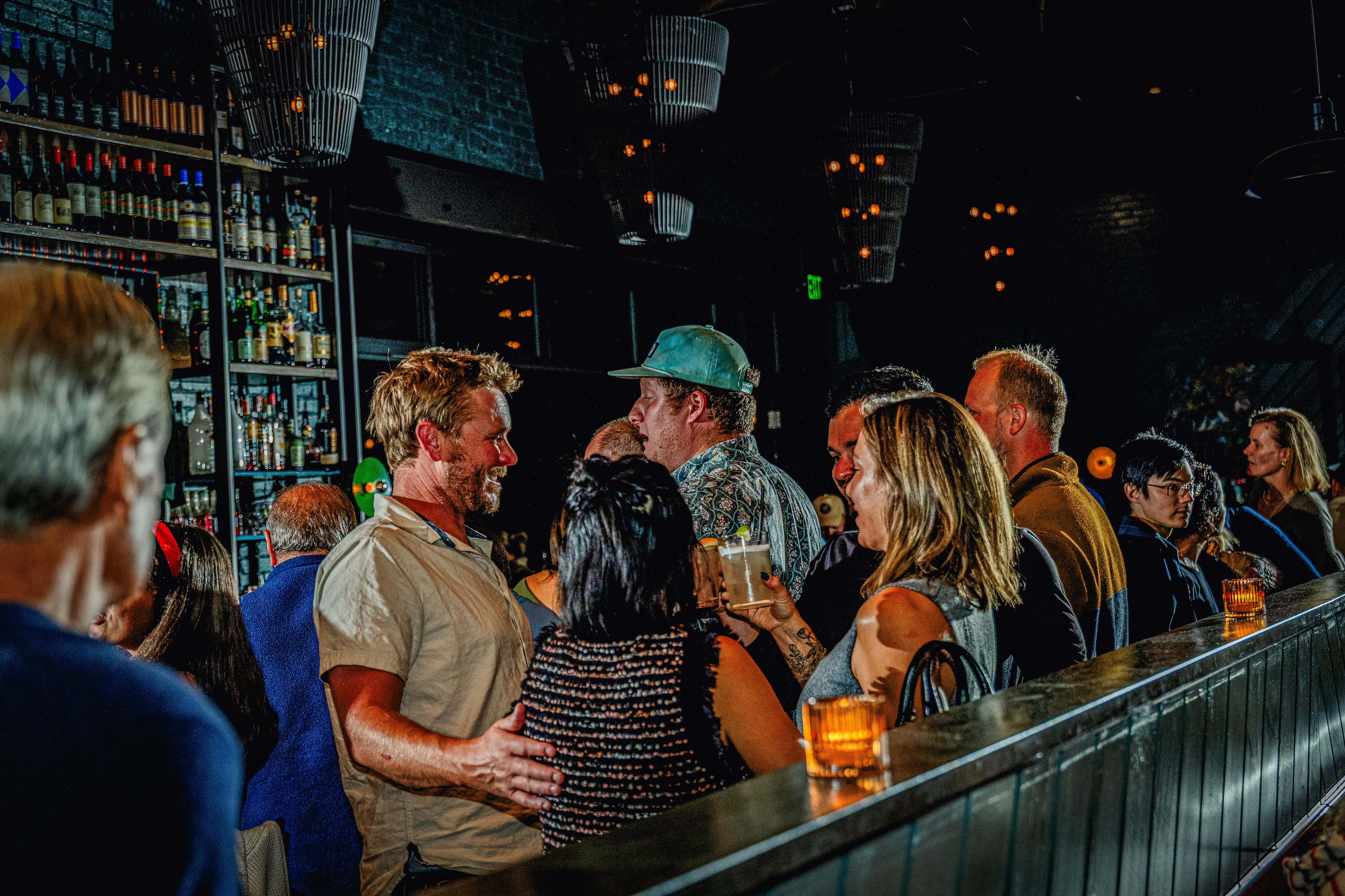 a group of people playing instruments and performing on a stage