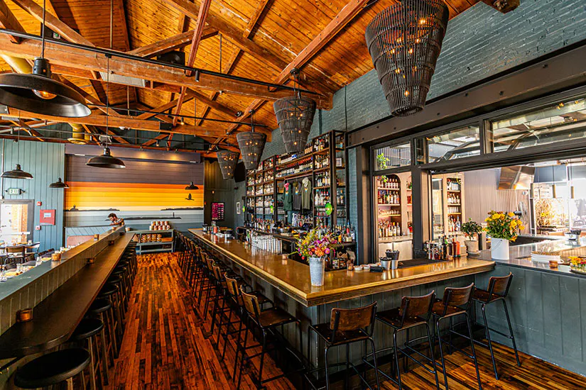 a bar with a wooden floor and a wood floor