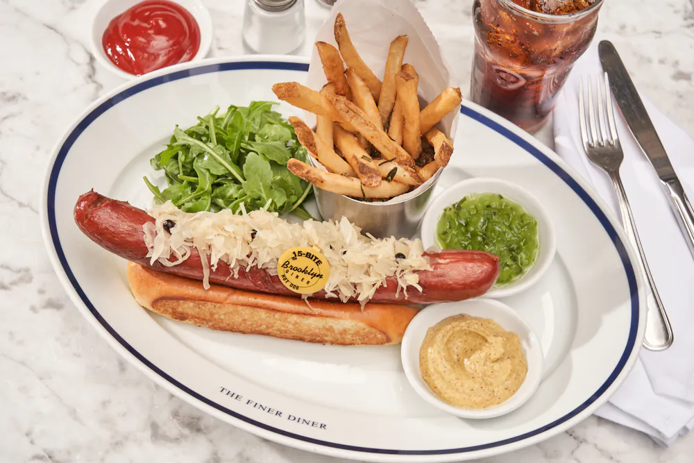 The 15-Bite all-beef frankfurter with juniper sauerkraut and hand-cut fries