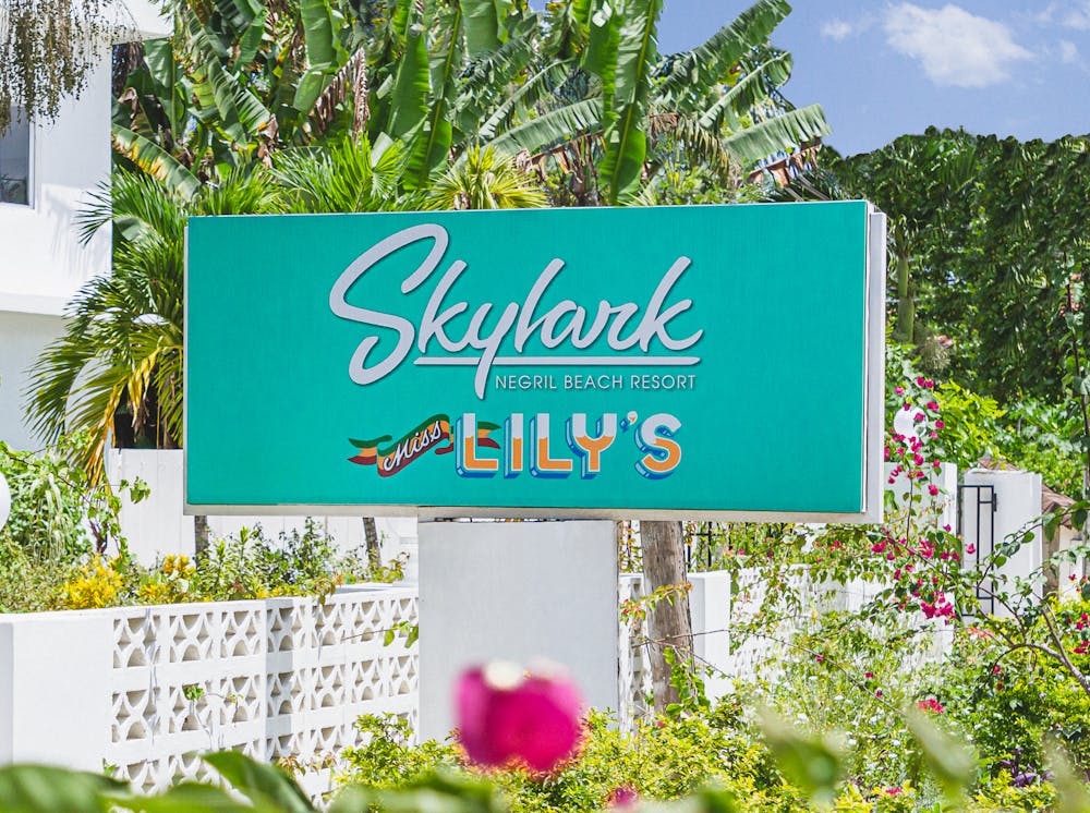 a sign in front of a flower