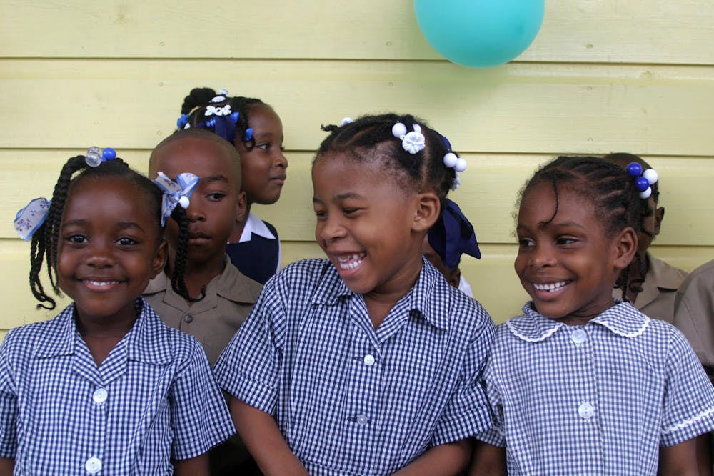 a group of girls posing for the camera