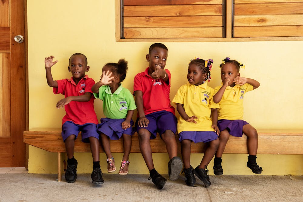 a group of kids posing for the camera