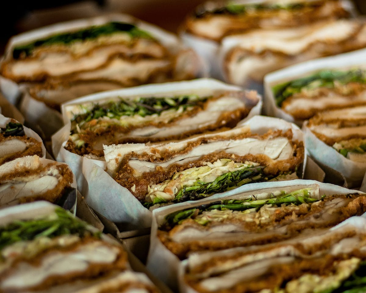 a close up of a sandwich and fries on a plate