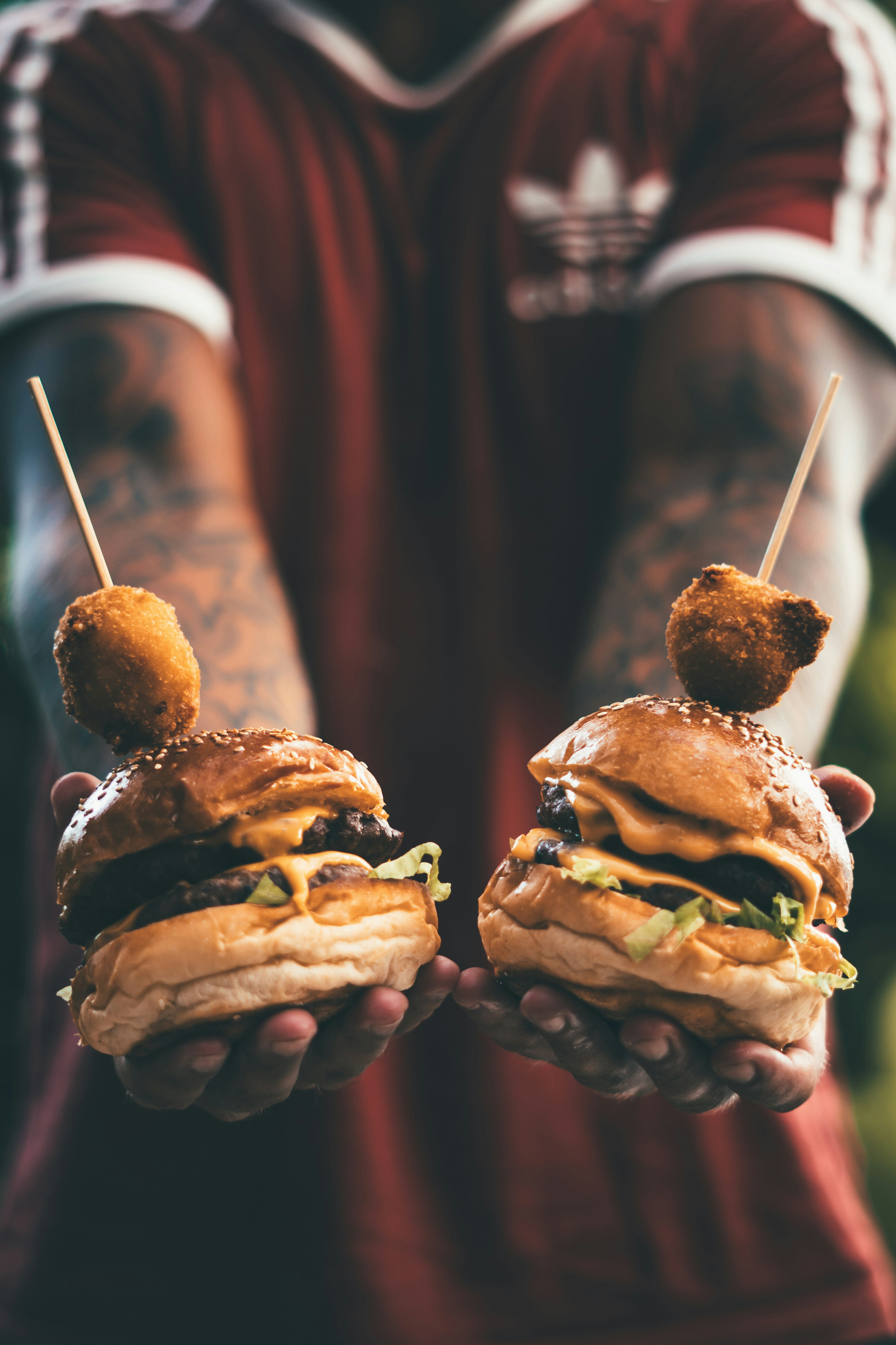 a close up of a person holding a sandwich