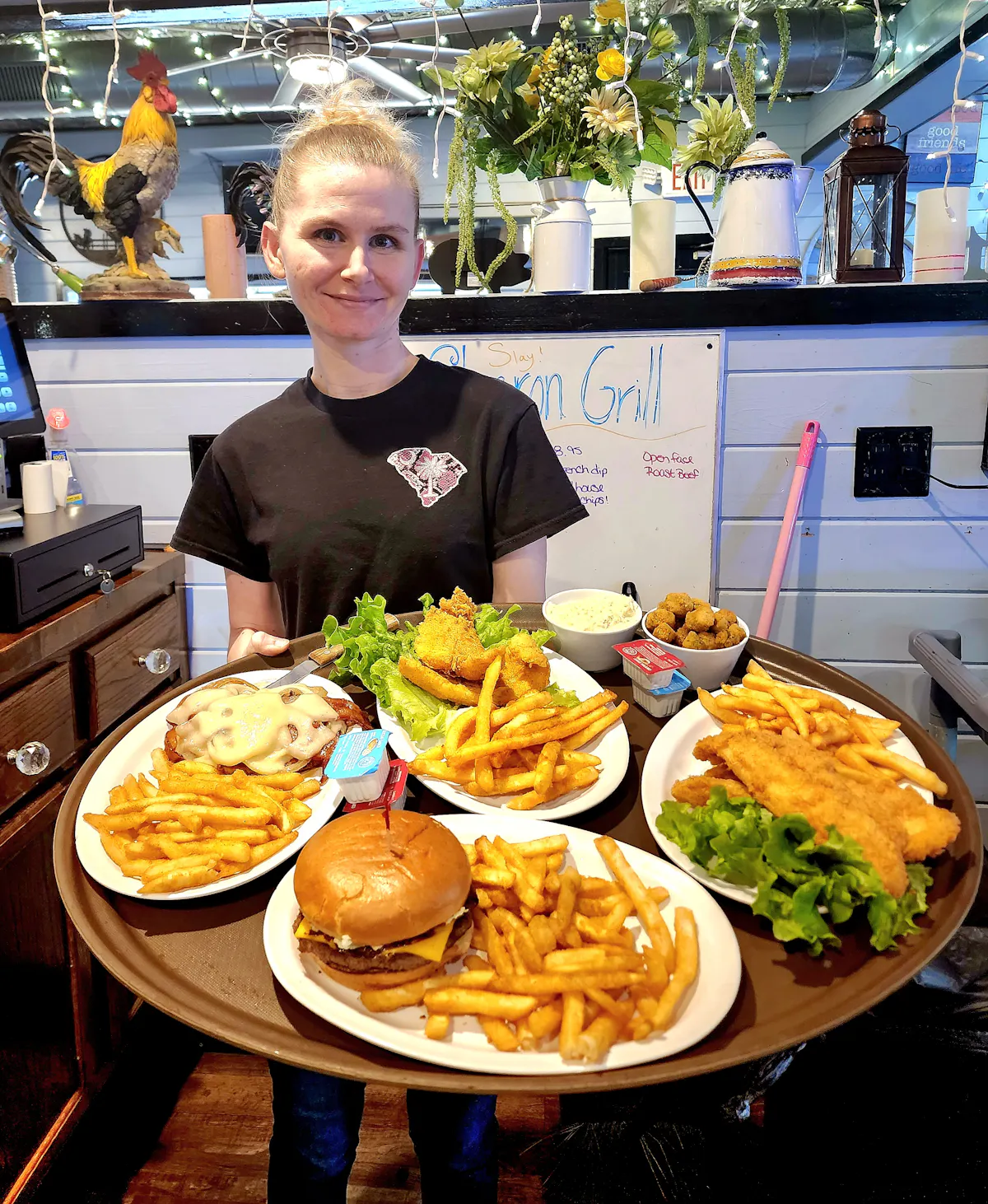 a person sitting at a table with a plate of food
