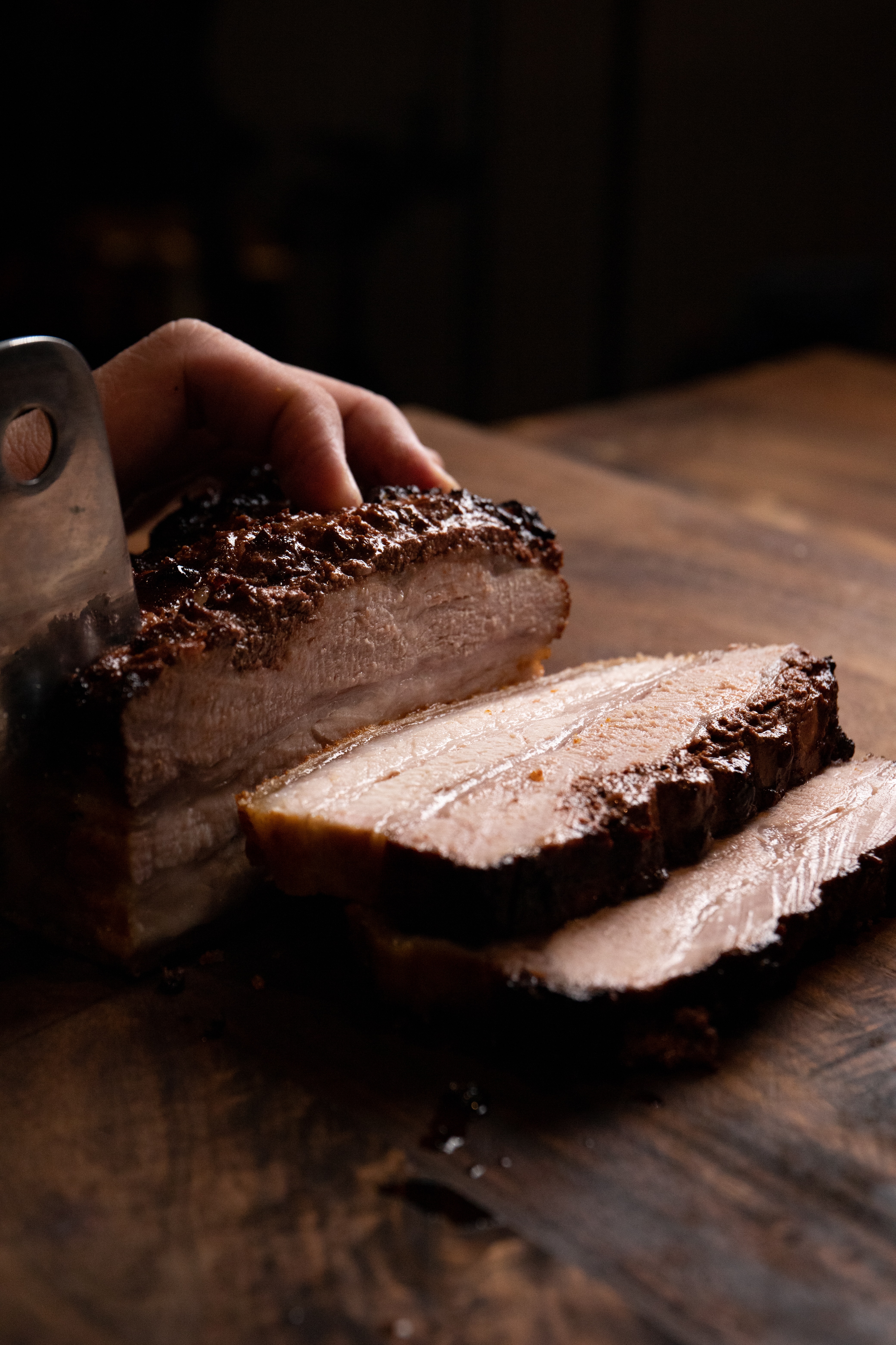 a piece of chocolate cake with a slice cut out