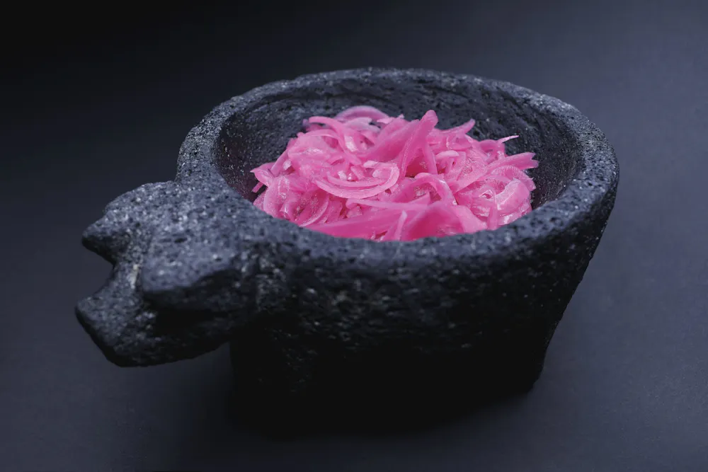 a close up of a pink cake