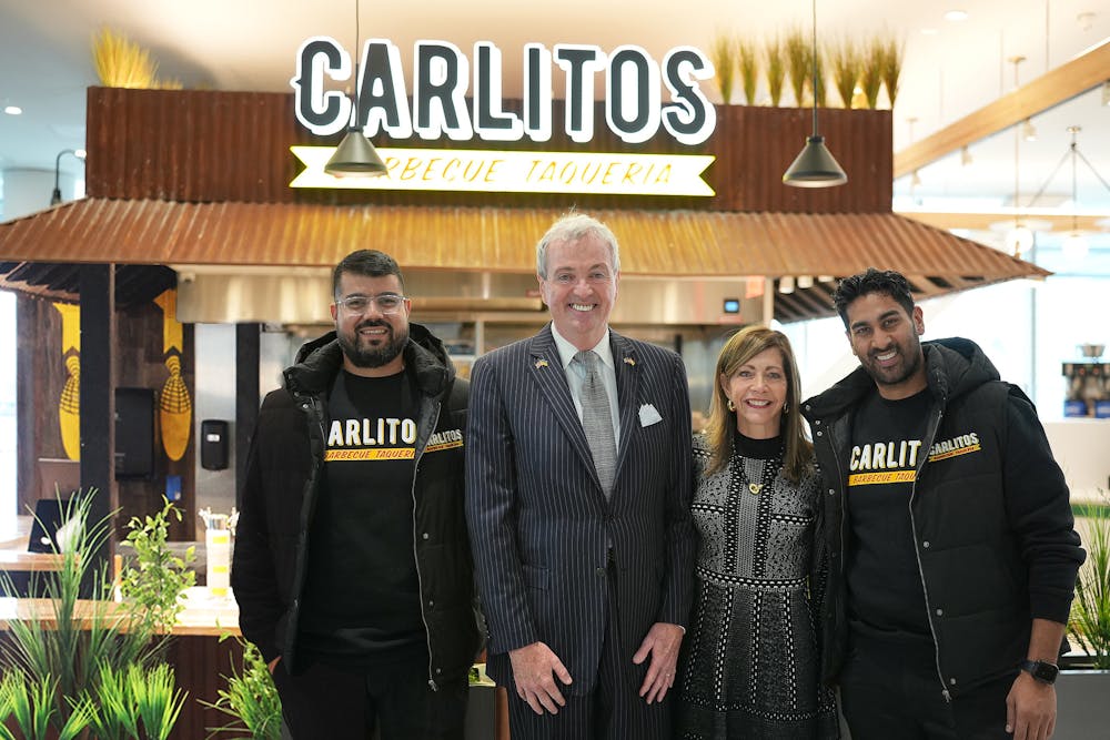 a man standing in front of Philip D. Murphy et al. posing for the camera
