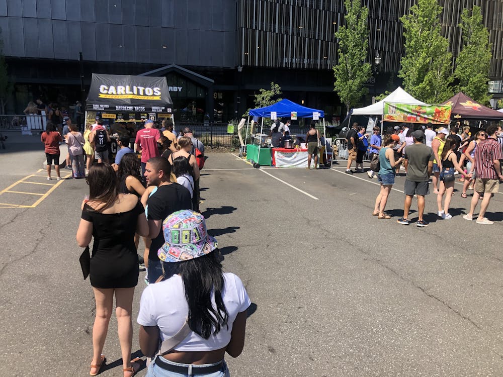 a group of people walking down the street