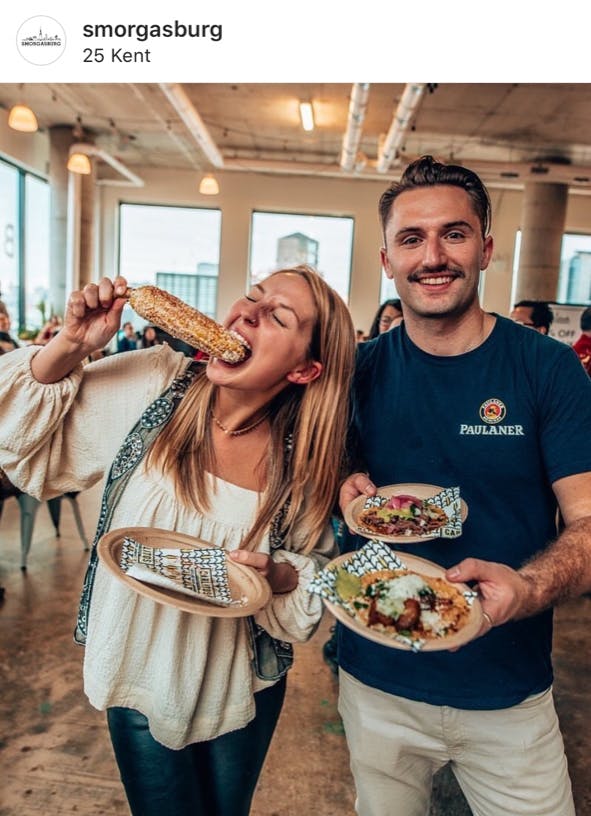 a person holding a plate of food