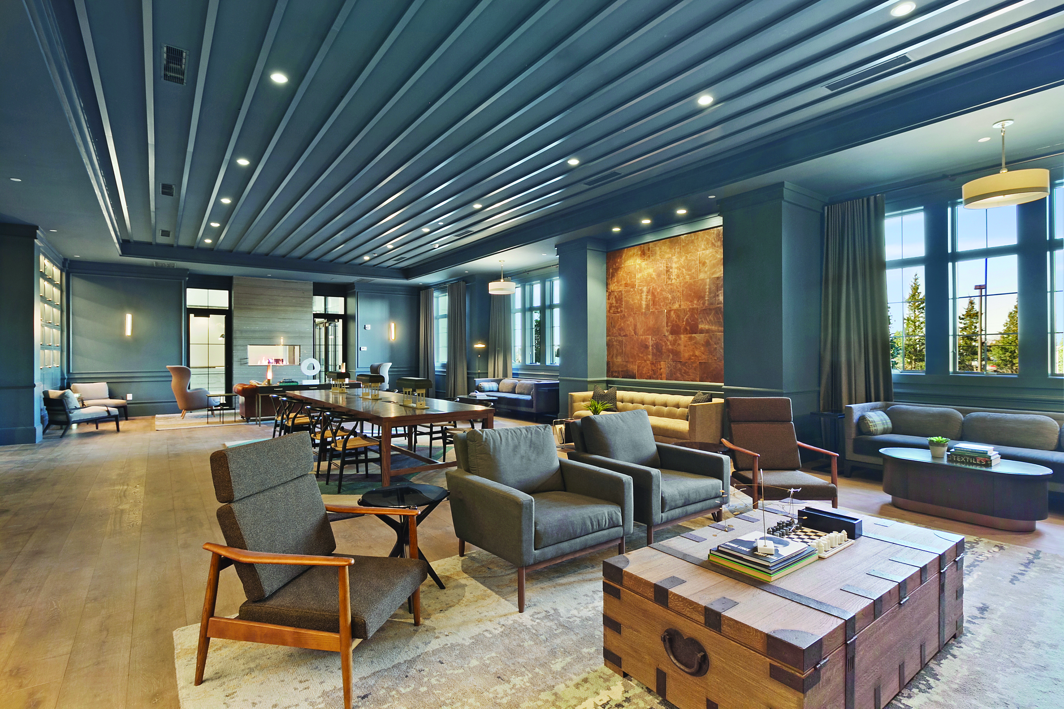 a room filled with furniture and a large window