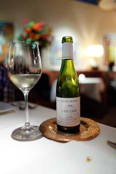 a close up of a bottle of wine on a table