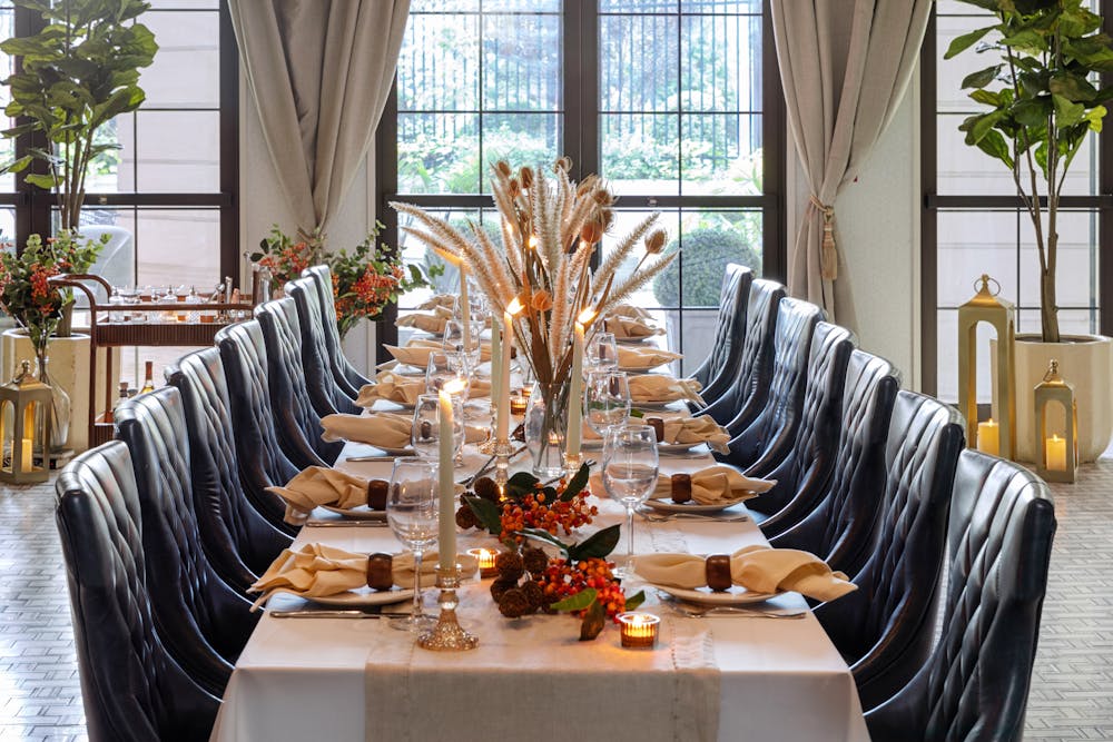 a dining room table in front of a window